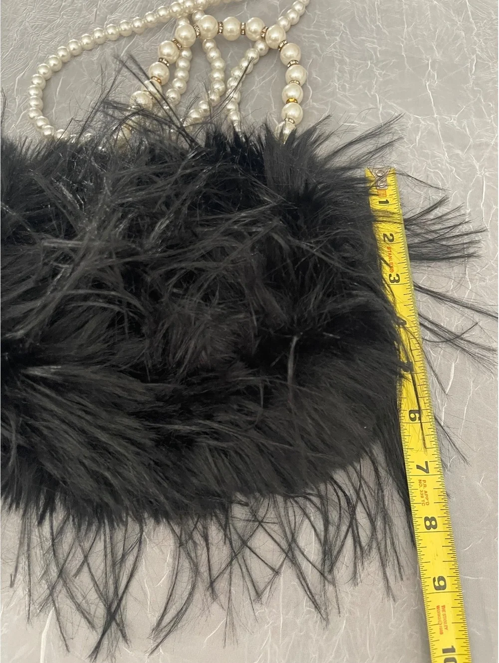 Black Faux Feather Purse with Prominent Pearl Strap.